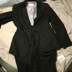2 piece Calvin Klein skirt suit with pockets